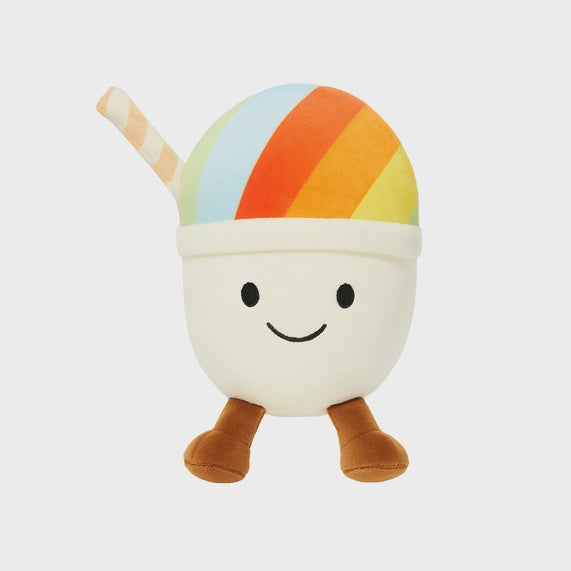 Plush toy by Jellycat of a shaved ice character centered on a neutral studio background featuring a vibrant rainbow-striped dome, a small striped straw, and signature brown corduroy legs with a stitched smiling face
