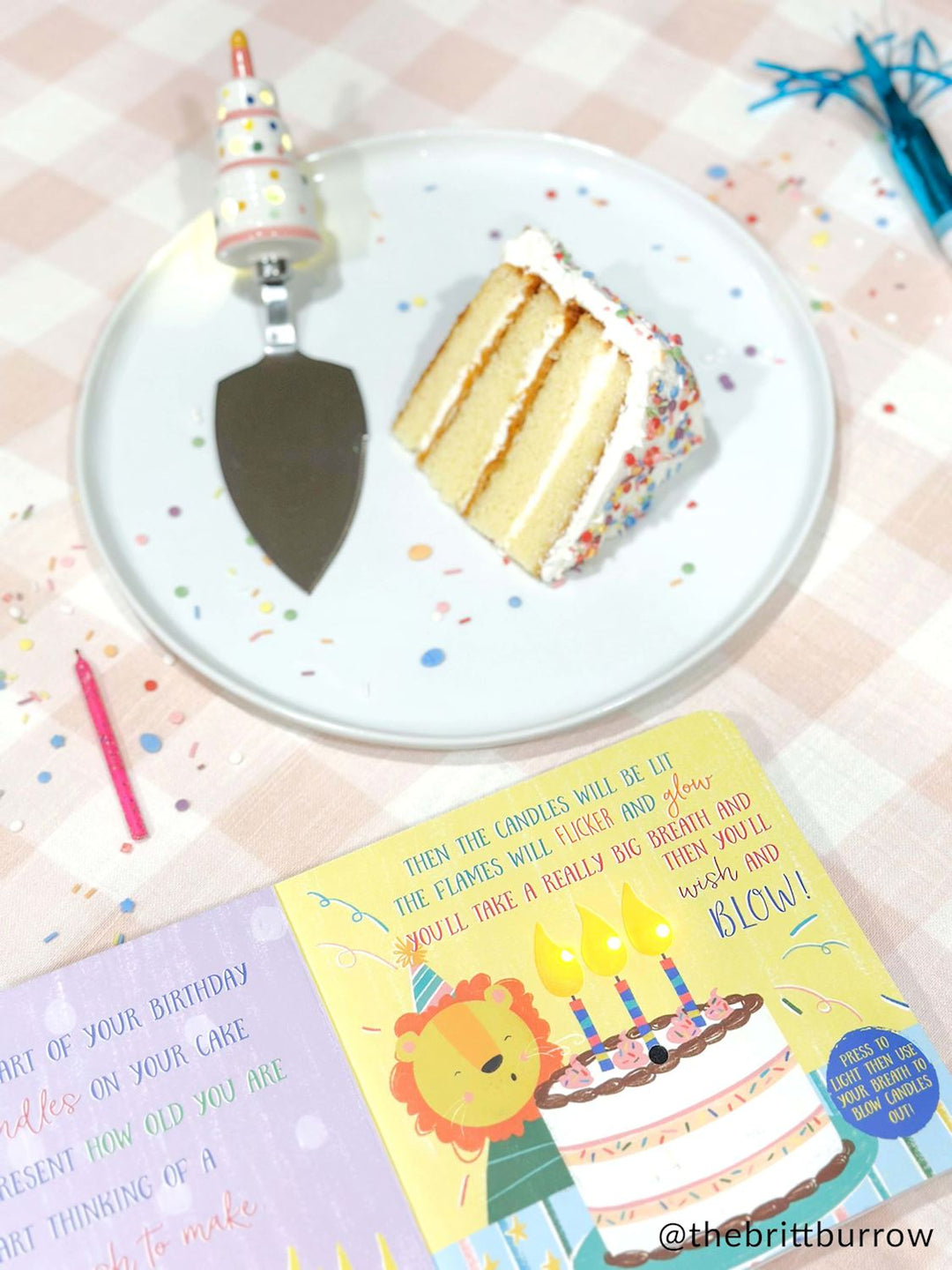 Photograph by @thebrittburrow of a slice of three-layer sprinkle cake and an open children&