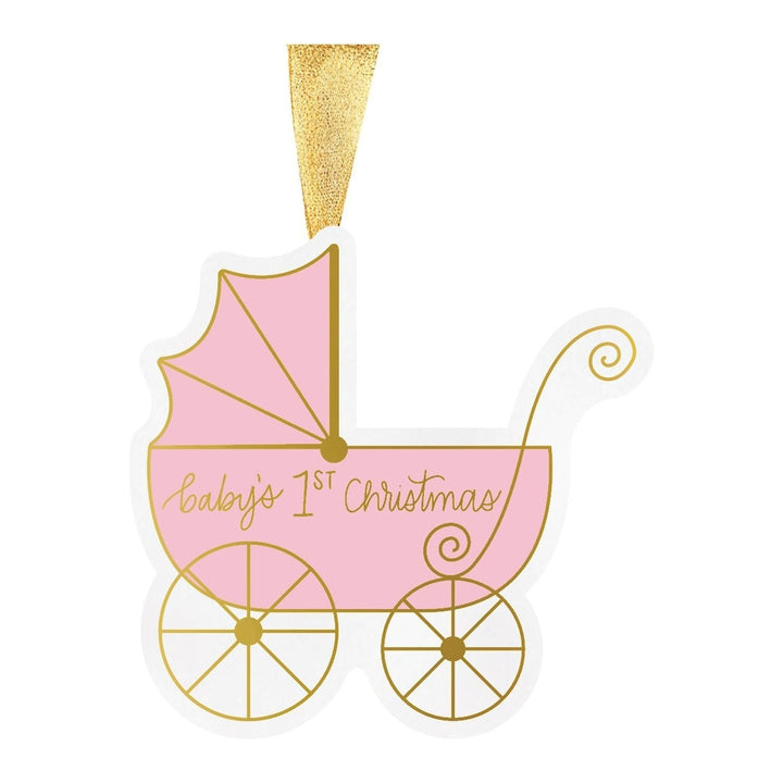 Graphic illustration of a pink baby carriage Christmas ornament on a white background featuring gold metallic script reading baby&