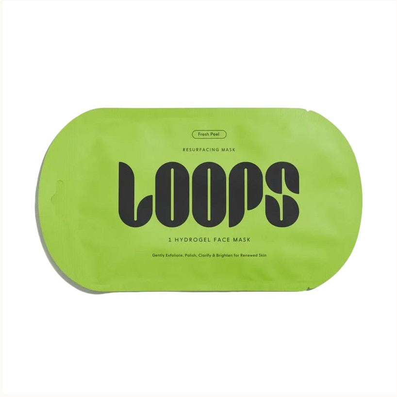 Product photography by LOOPS showcasing a lime green Fresh Peel Resurfacing Mask pouch centered on a white background featuring bold black stylized typography and a unique rounded rectangular shape