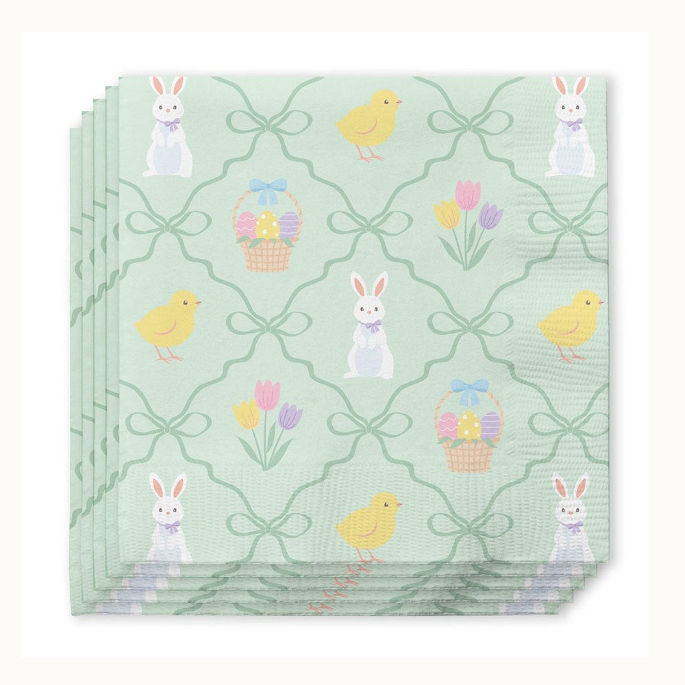 Paper napkins featuring a whimsical Easter pattern with white bunnies wearing lavender bows, yellow chicks, and wicker baskets of colorful eggs within a green wavy lattice design on a mint green background