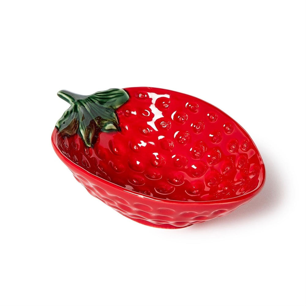 Ceramic strawberry-shaped serving bowl showcased on a white background featuring a vibrant glossy red glaze, realistic dimpled seed patterns, and a sculpted green leafy stem handle