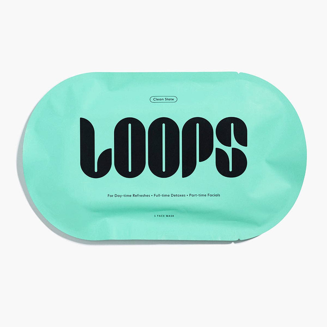 Product photography for LOOPS featuring a Clean Slate face mask in a seafoam green oval pouch with bold black stylized typography and minimalist product descriptions centered on a plain white background