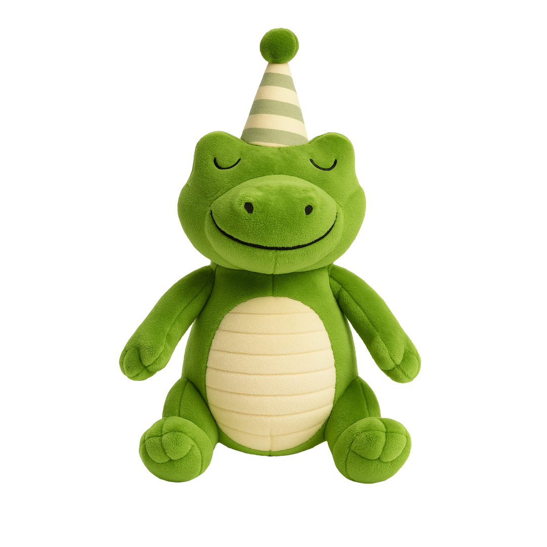 Plush stuffed toy of a happy green frog sitting against a white background wearing a striped party hat with a pom-pom and featuring a cream-colored ribbed belly and a serene smiling expression with closed eyes