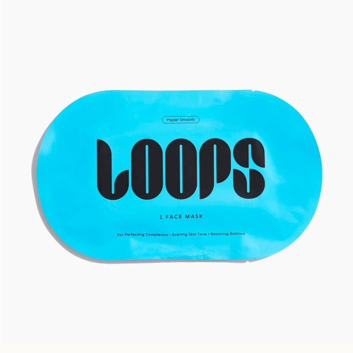 Commercial product photograph by Loops Beauty of a vibrant turquoise Hyper Smooth face mask packet in a minimalist oval shape featuring bold black LOOPS typography and descriptive text for perfecting complexion on a clean white background
