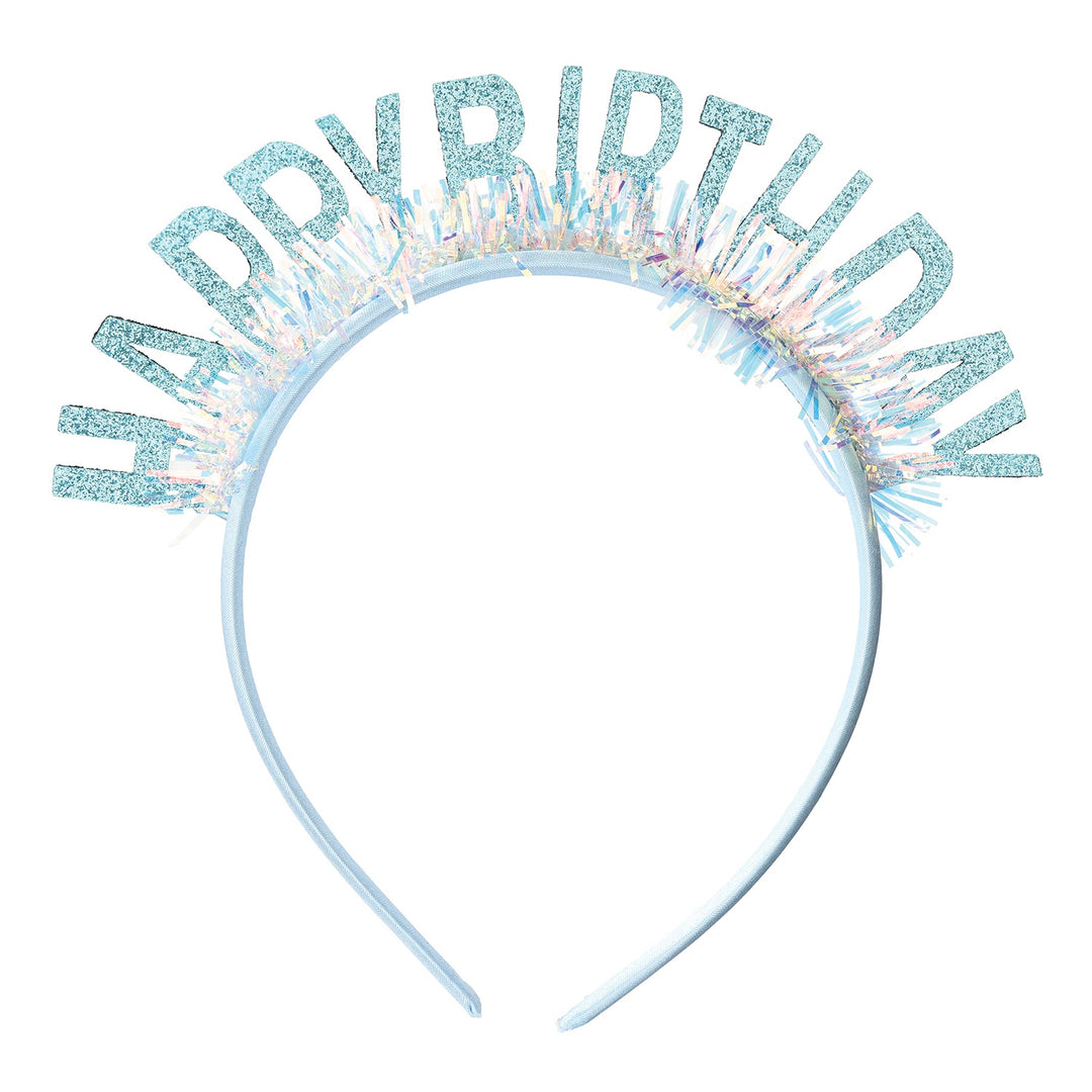 Studio photograph of a light blue Happy Birthday headband accessory featuring glittery block letters and an iridescent tinsel fringe against a plain white background