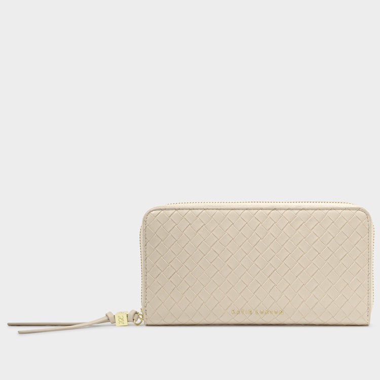 Vegan leather wallet by Katie Loxton showcases a cream-colored woven texture and gold-toned embossed logo with a matching tassel zipper pull and KL charm on a plain background