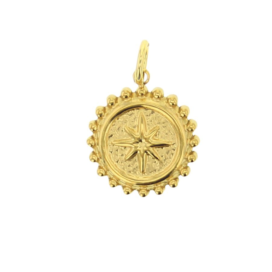 Gold jewelry pendant featuring a central eight-pointed starburst with a hammered texture and a granulated beaded border against a plain white background