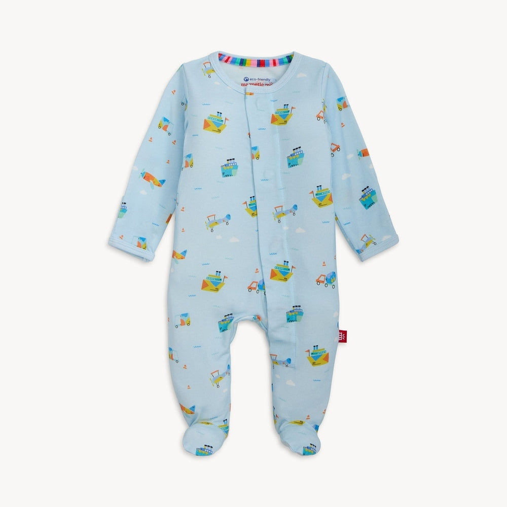 Magnetic Me light blue cotton baby footie pajama featuring a vibrant transportation pattern of illustrated ships and airplanes with a colorful rainbow-striped interior neckline