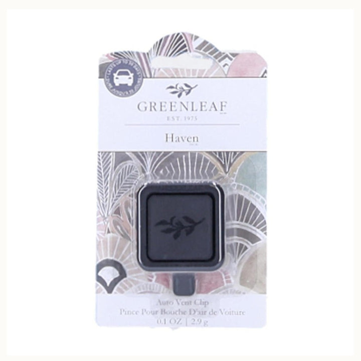 Product photography by Greenleaf of a Haven Auto Vent Clip on retail packaging featuring a muted botanical fan pattern, a car icon, and a black square clip with an embossed leaf logo