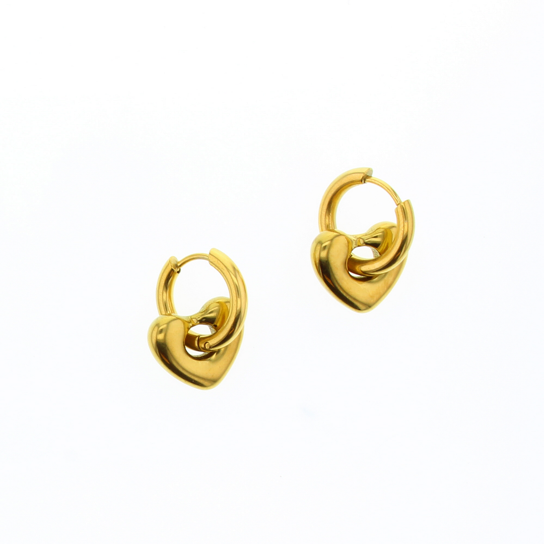 Gold-plated jewelry hoop earrings with three-dimensional puffy heart charms are centered on a white background featuring a polished high-shine finish and secure huggie closures