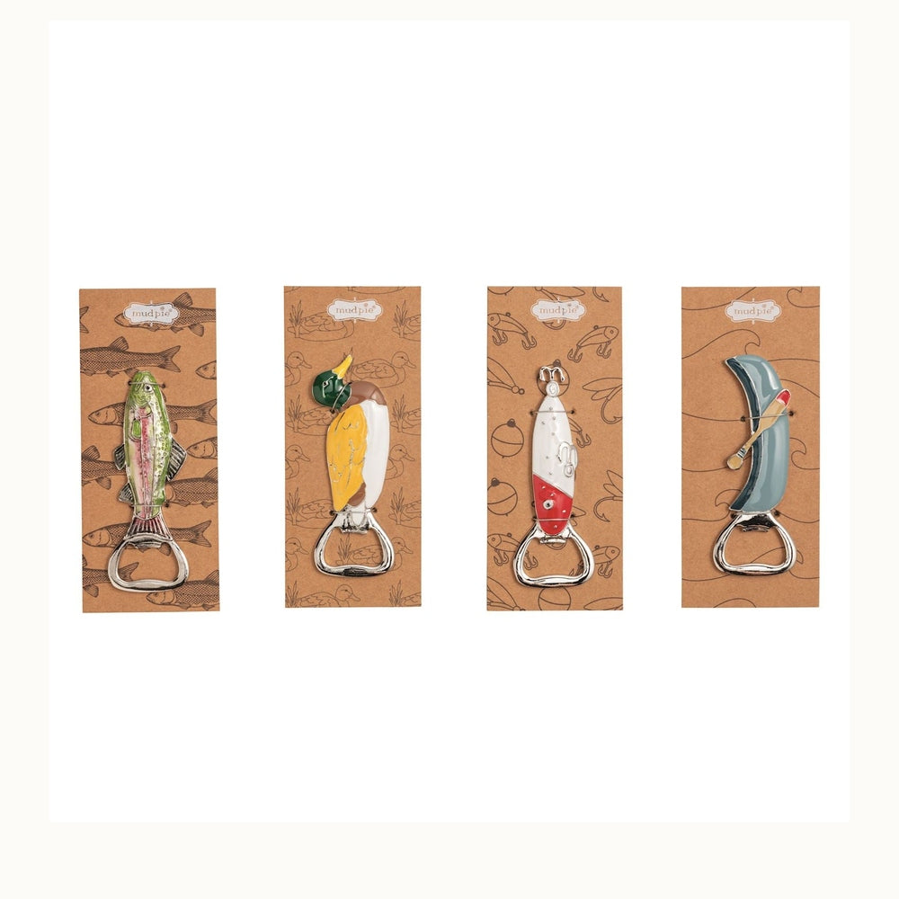 Enamel and metal bottle openers by Mud Pie featuring outdoor-themed designs of a shimmering green trout, a yellow mallard duck, a red-and-white fishing lure, and a blue canoe with a wooden oar displayed on decorative brown cardstock packaging