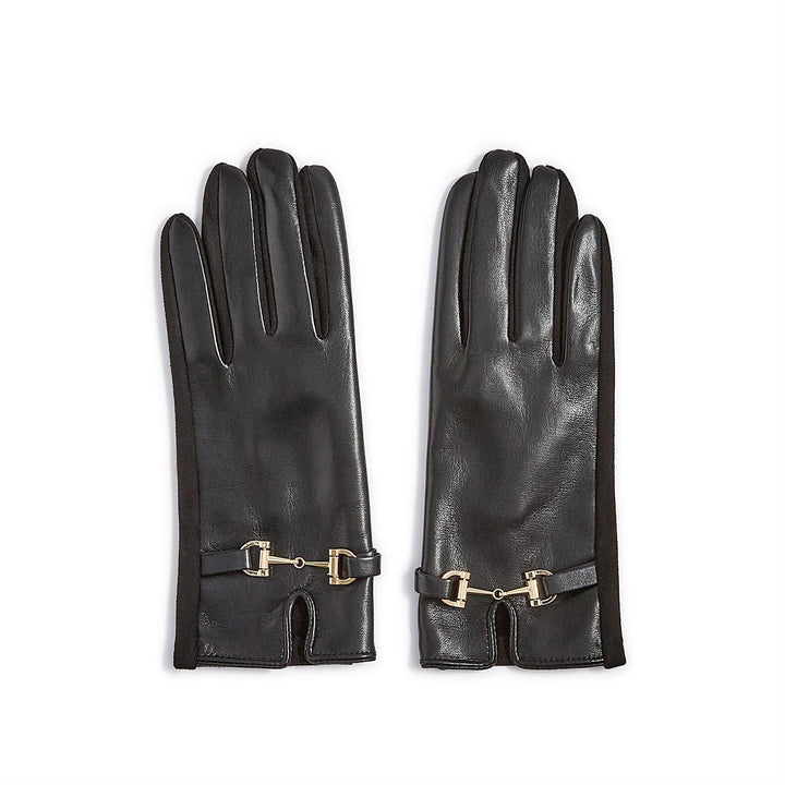 Photograph of Gucci black leather gloves featuring the iconic gold-tone horsebit hardware, soft suede side panels, and a small notched wrist cuff set against a plain white background