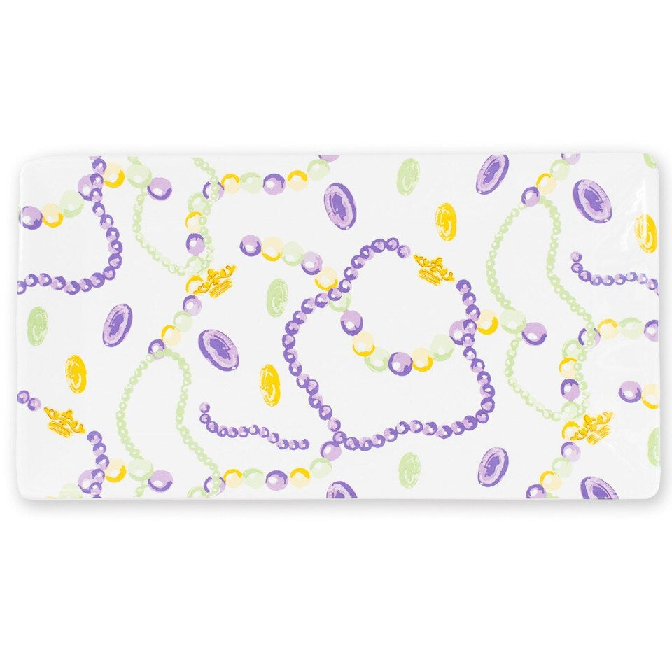 Fine bone china tray by Halcyon Days featuring an illustrated jewelry pattern of lavender beaded necklaces, golden crowns, and purple cameos on a white background