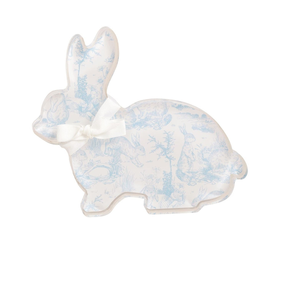Acrylic rabbit tray by an unidentified designer featuring light blue Toile de Jouy pastoral scenes of woodland flora on a white background with a white grosgrain bow tied around its neck and transparent polished edges