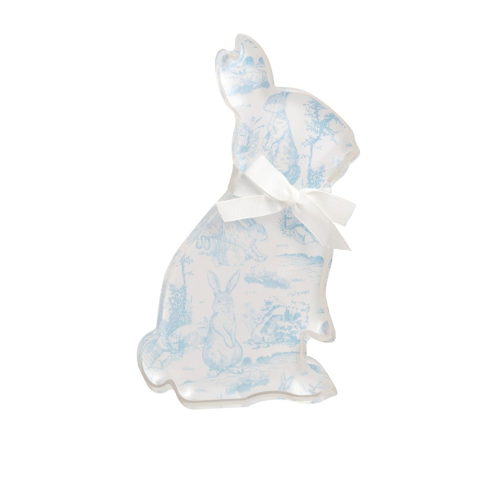 Acrylic bunny figurine in a sitting silhouette profile featuring a light blue toile de jouy pastoral pattern and a white ribbon bow tied around the neck