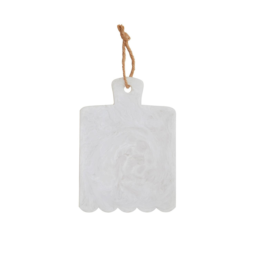 White marbled resin serving board featuring a scalloped bottom edge and a rustic knotted jute rope loop with subtle translucent swirls isolated on a white background
