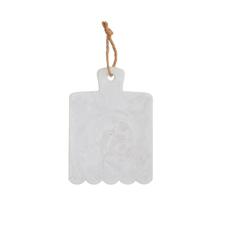 White marbled resin serving board featuring a scalloped bottom edge and a rustic knotted jute rope loop with subtle translucent swirls isolated on a white background