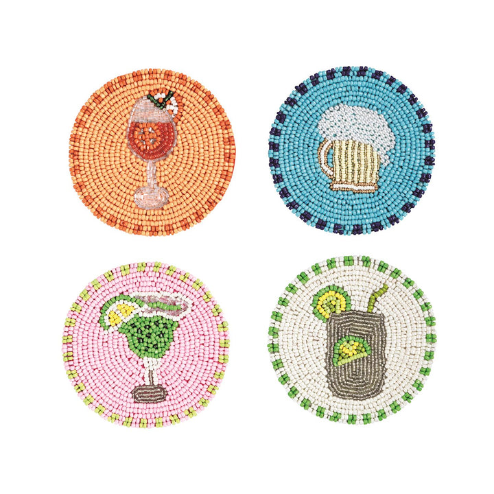 Hand-beaded glass coasters featuring a set of four vibrant beverage designs including a frothy beer mug on blue and a lime-garnished margarita on pink with circular patterns of colorful seed beads isolated on a white background