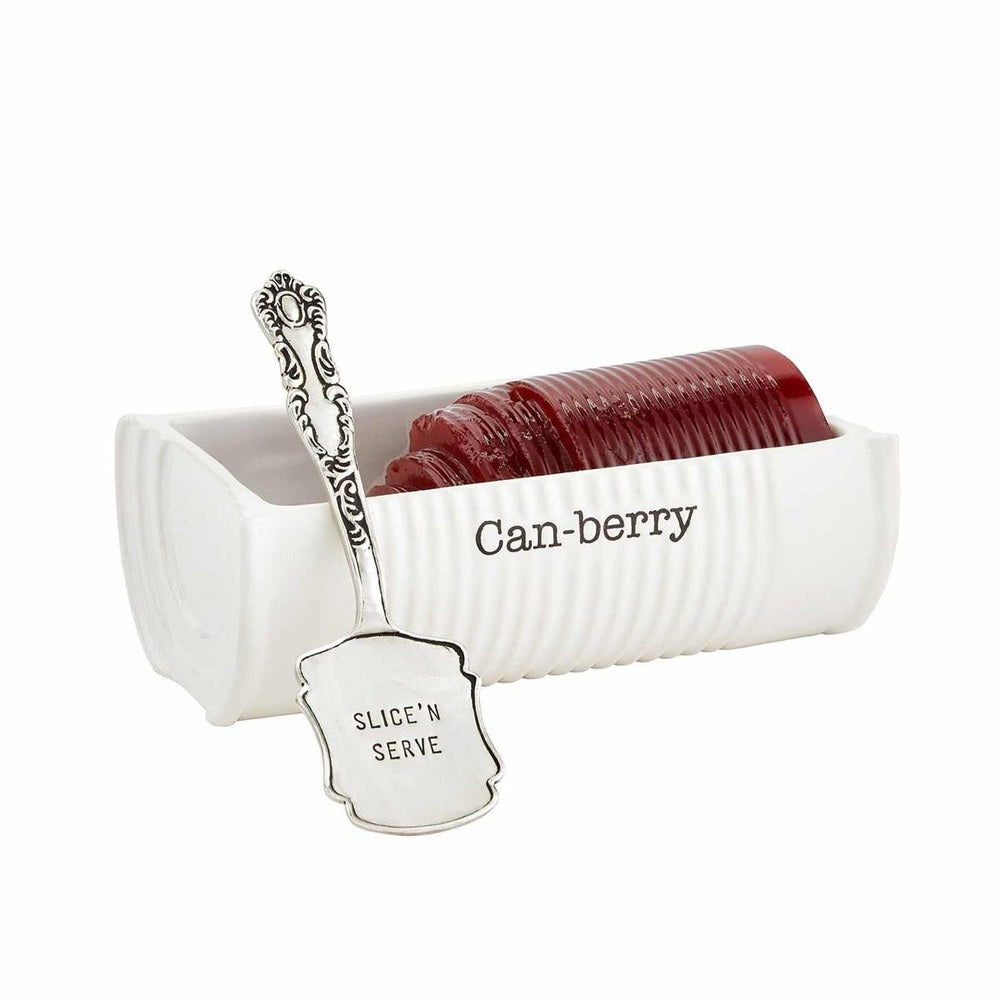 Ceramic Mud Pie serving set featuring a white ribbed dish labeled Can-berry filled with dark red jellied cranberry sauce and an ornate silver spoon stamped with Slice N Serve against a plain white background