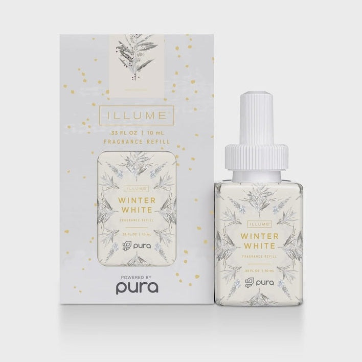 Product photograph of the Illume Winter White fragrance refill for Pura featuring a white box and vial adorned with intricate grey evergreen botanical illustrations and shimmering gold metallic speckles against a neutral studio background