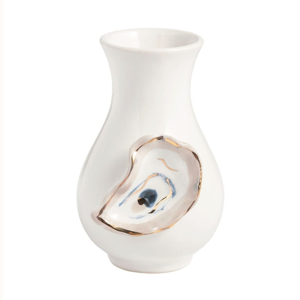 Ceramic oyster bud vase by Grit and Grace Studio featuring a glossy white porcelain body and a hand-painted oyster shell motif with a shimmering gold-leaf rim and blue-tinted interior details on a white background