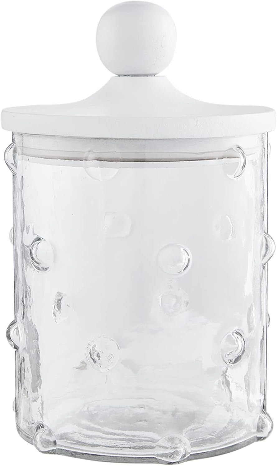 Photograph of a clear glass kitchen storage canister featuring a raised hobnail bubble texture and a matte white lid with a spherical top knob set against a plain background