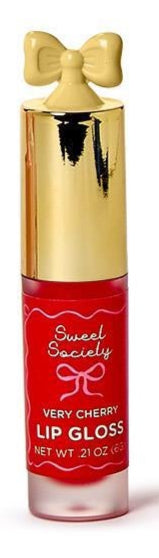 Product photograph by Sweet Society of a Very Cherry Lip Gloss tube against a plain white background, featuring a decorative yellow bow-shaped topper, a shiny metallic gold cap, and a vibrant red label with pink cursive text and a bow illustration