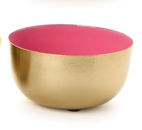 Metal decorative bowl featuring a vibrant fuchsia pink enameled interior and a brushed gold metallic exterior finish against a white background