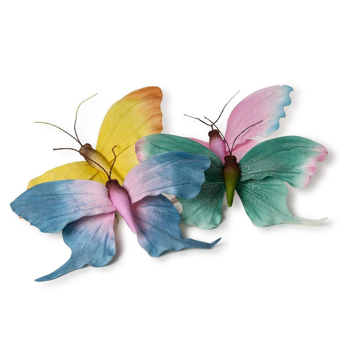 Decorative fabric butterfly ornaments featuring three colorful subjects on a white background with gradient wings in pastel shades of blue, yellow, and green accented by delicate wire antennae and fuzzy bodies
