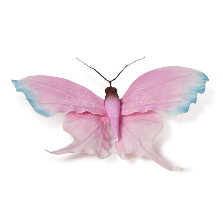Decorative resin sculpture of a pink butterfly on a plain white background featuring light blue wing tips, intricate vein-like textures, and a fuzzy dark brown thorax