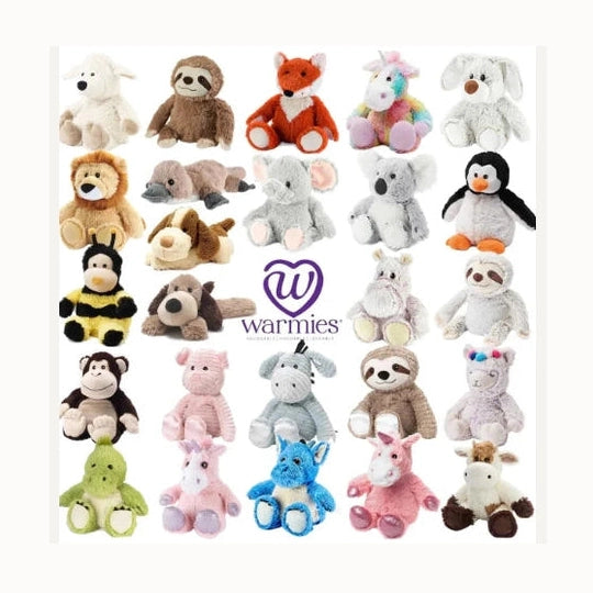 Product photography of Warmies brand plush toys features a grid of stuffed animals including a rainbow unicorn and a penguin on a white background with a fuzzy yellow bumblebee and a central purple heart logo