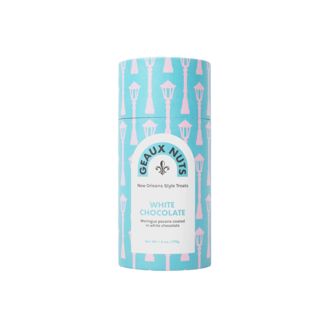 Product packaging by Geaux Nuts featuring a cylindrical canister of New Orleans style white chocolate meringue pecans decorated with iconic pink New Orleans gas lamps on a light blue background and a black fleur-de-lis symbol
