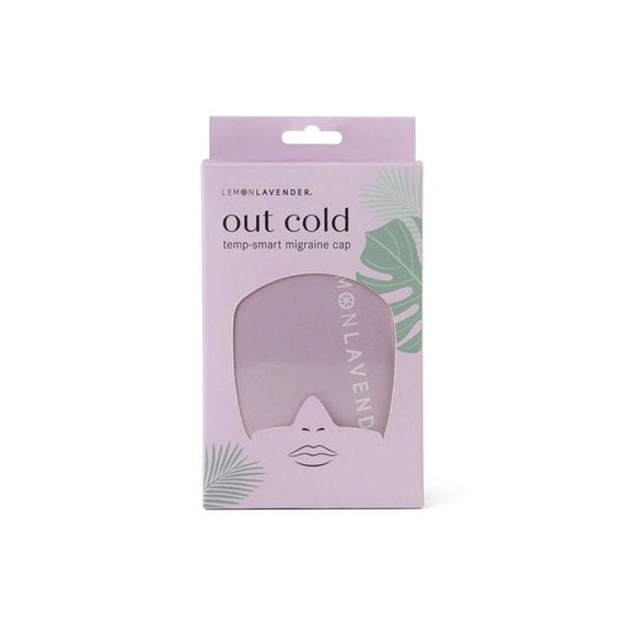 Product photography for Lemon Lavender showcasing the out cold temp-smart migraine cap in a lilac box accented with green tropical leaf motifs and a minimalist face-shaped cutout