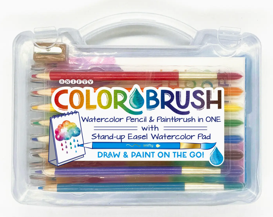 Snifty Color Brush watercolor pencil and paintbrush set in a clear plastic carrying case featuring the vibrant rainbow Snifty logo, a variety of colorful pencils with brush tips, and a wooden sharpener above a stand-up easel watercolor pad