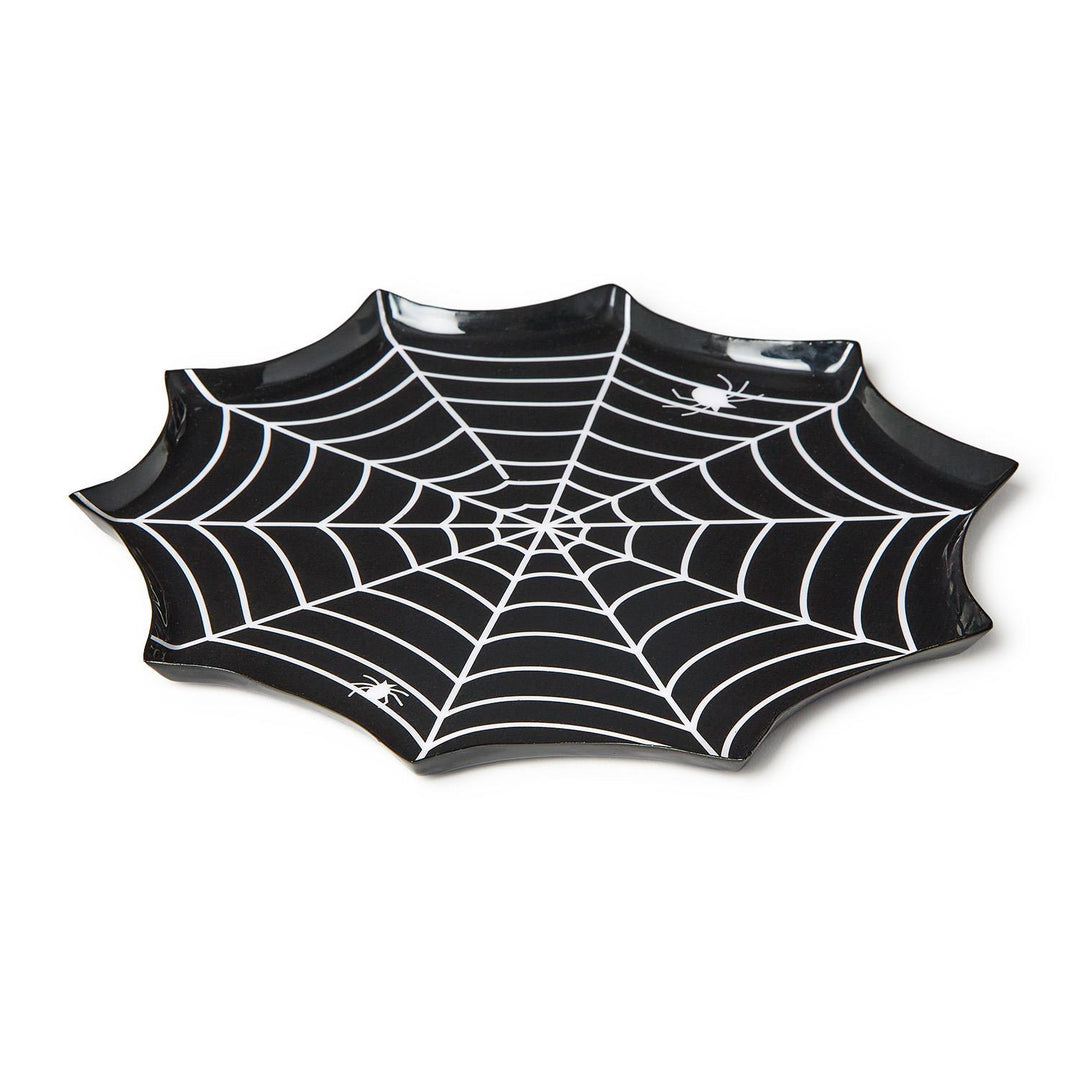 Melamine serving tray featuring a spider web shaped Halloween design on a white background with a scalloped edge, intricate white web lines, and two small white spider graphics