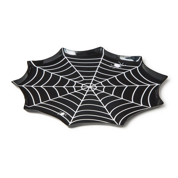 Melamine serving tray featuring a spider web shaped Halloween design on a white background with a scalloped edge, intricate white web lines, and two small white spider graphics