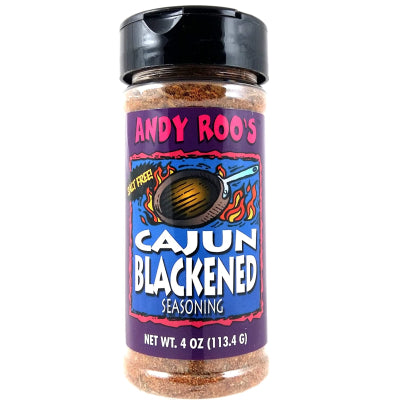 Product photography of a bottle of Andy Roo’s Cajun Blackened Seasoning featuring a vibrant purple label with a flaming skillet illustration and a clear view of the textured salt-free reddish spice blend