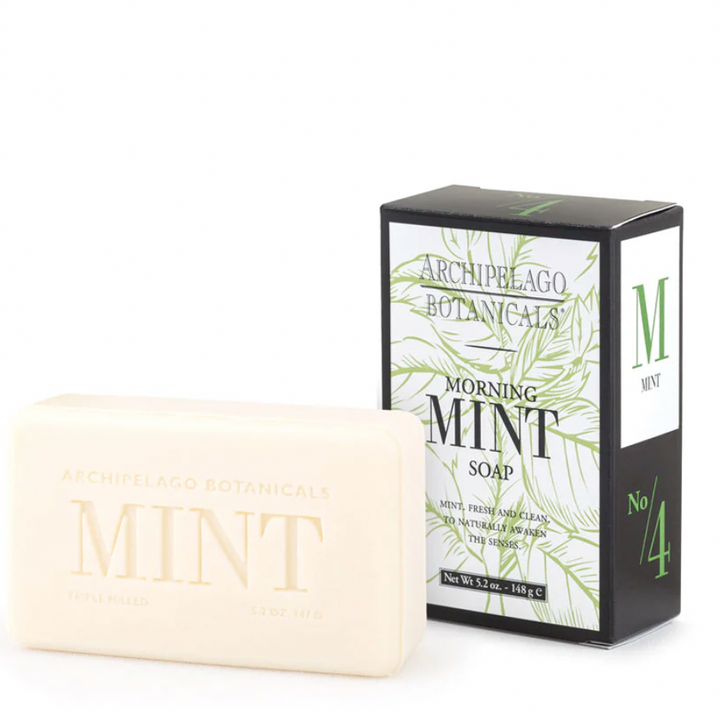 Product photograph by Archipelago Botanicals featuring a bar of Morning Mint soap next to its box on a white background, highlighting the embossed cream-colored bar, green botanical illustrations, and bold No. 4 branding