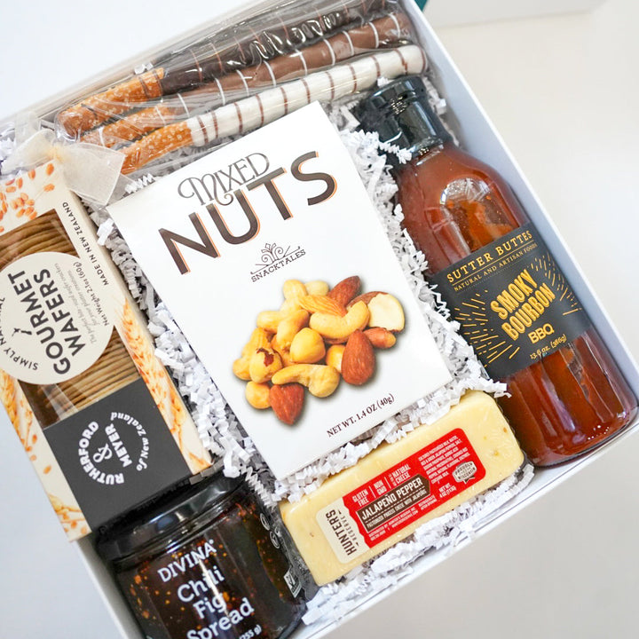 Gift box with snacks and drinks on a white background