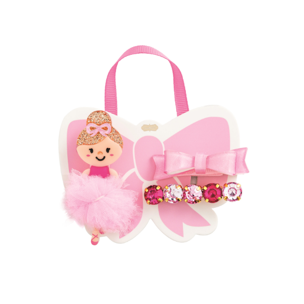 Mixed-media boutique hair accessory set featuring a ballerina hair clip and jeweled barrette centered on a pink bow-shaped card, highlighting a fluffy pink tulle tutu, glittery gold hair, and a row of faceted magenta and pale pink rhinestones