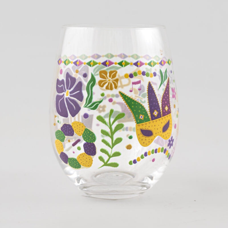 Stemless glass tumbler featuring New Orleans Mardi Gras imagery including a festive yellow and purple masquerade mask, a ring of colorful beads, and vibrant purple floral patterns