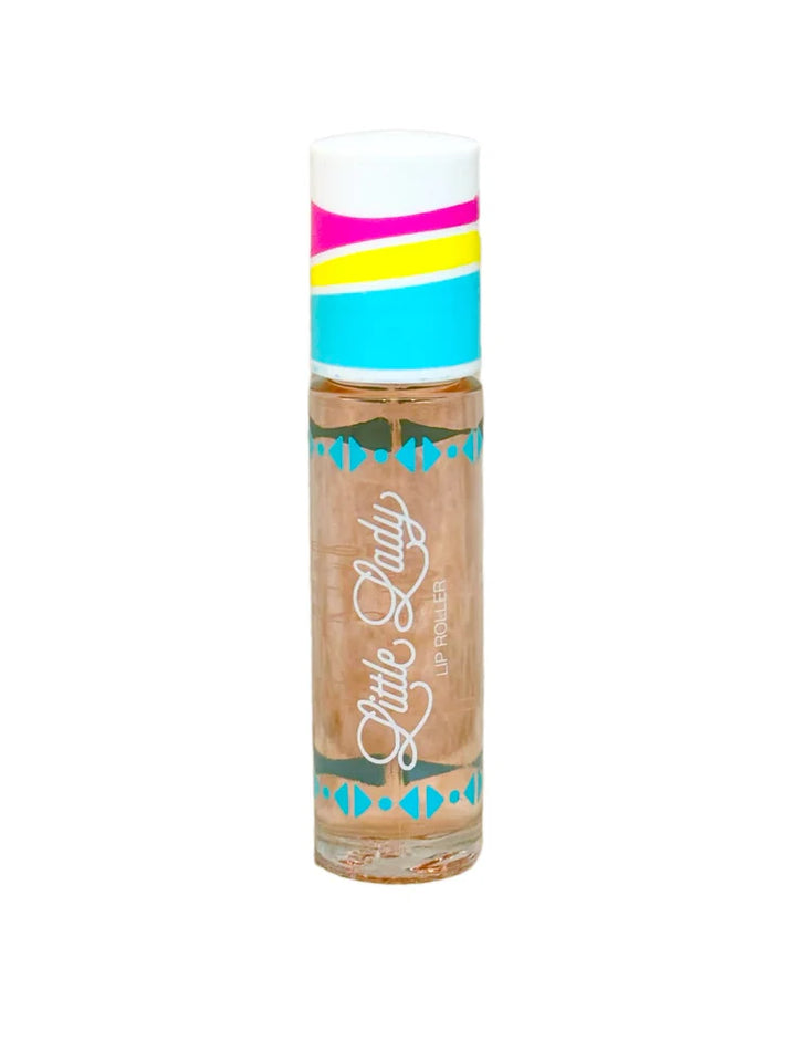 Product photograph by Little Lady of a lip roller on a white background featuring a cap with vibrant pink, yellow, and blue stripes, teal geometric motifs, and white cursive branding over a peach-colored liquid