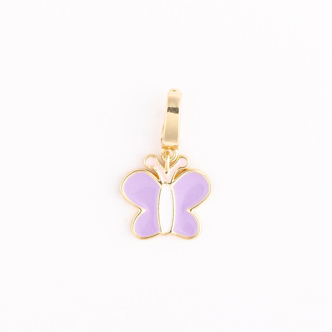 Gold enamel butterfly charm centered on a plain white background featuring lavender purple wings, a slender white body, and a polished gold-toned metal frame with a matching top bail