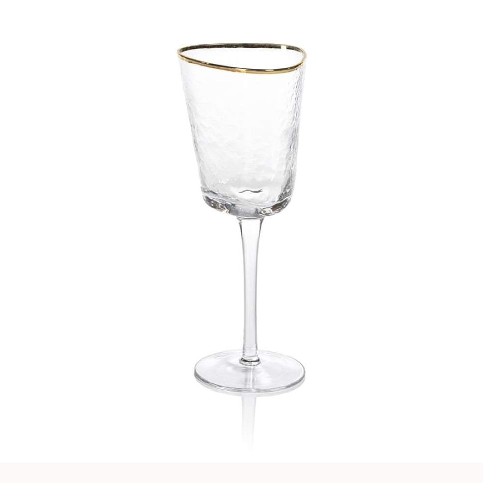 Hand-crafted textured glass wine goblet centered on a white background featuring a tall slender stem, a metallic gold rim, and a unique hammered finish with soft reflections