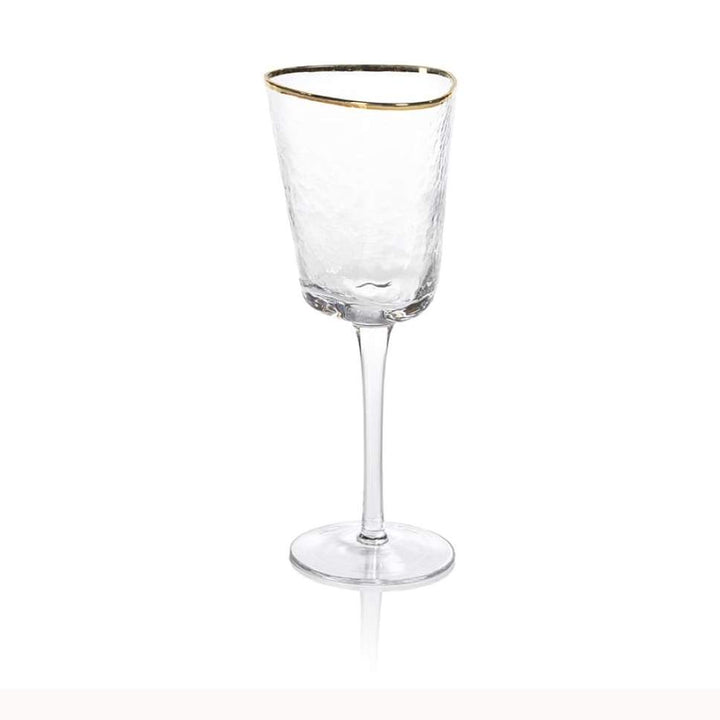 Hand-crafted textured glass wine goblet centered on a white background featuring a tall slender stem, a metallic gold rim, and a unique hammered finish with soft reflections