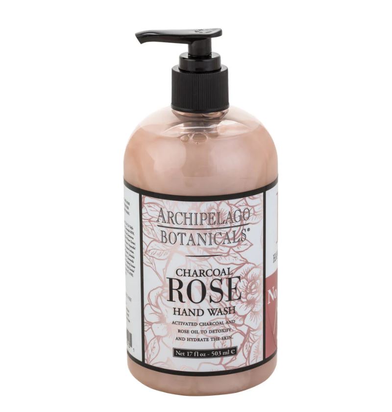 Product photograph by Archipelago Botanicals of Charcoal Rose Hand Wash on a white background featuring a black pump dispenser and an intricate botanical-illustrated label containing a dusty rose liquid