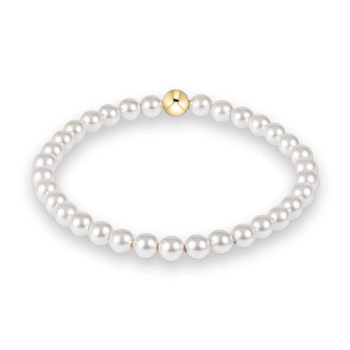 Pearl bracelet with a gold clasp on a white background