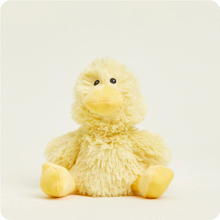 Plush toy by Jellycat of a yellow duckling centered on a white background featuring shaggy textured fur, small black bead eyes, and a smooth yellow beak