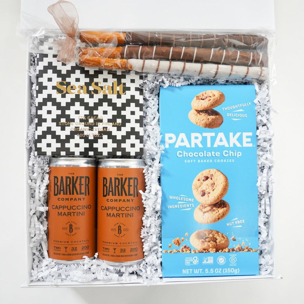Gift set with Barker drinks and Partake cookies on a white background